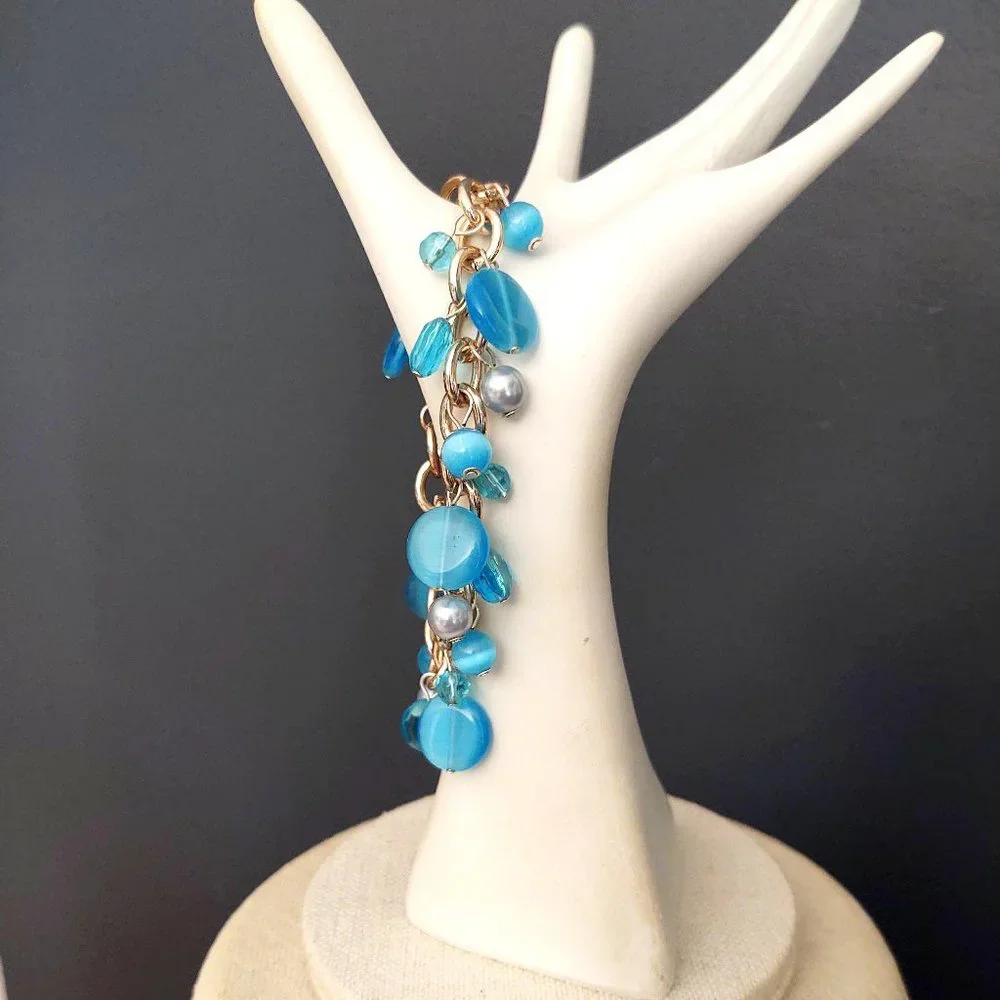 Blue bead and faux pearl charm style bracelet